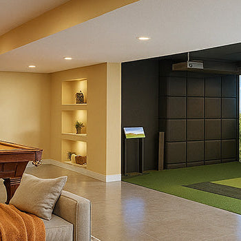 Basement golf simulator room with pool table and modern lounge furniture.