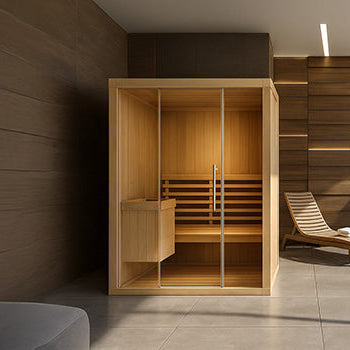Minimalist indoor sauna with glass walls in a luxury spa room overlooking a lake and snow-covered mountain view
