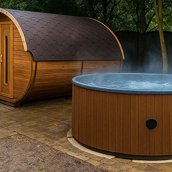 Steaming round wooden hot tub and barrel sauna in a secluded garden setting.