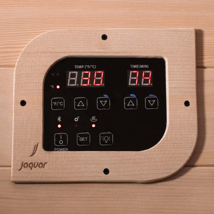 A sleek, wood-framed digital display for adjusting sauna temperature, timer, and Bluetooth settings.