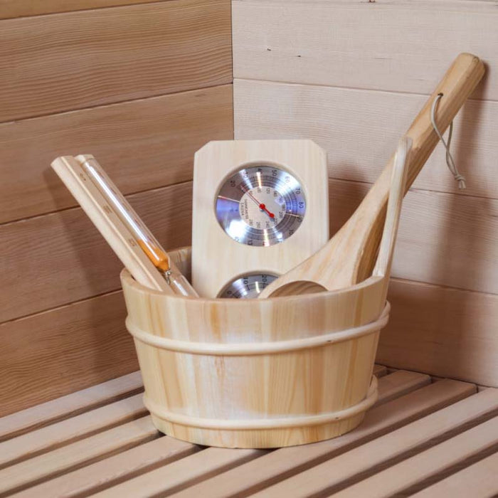 A luxury sauna accessory kit featuring a wooden bucket, ladle, thermometer, and sand timer.