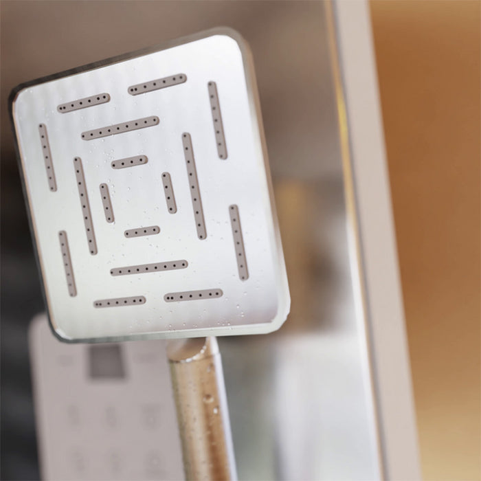 Maze-design handheld shower head inside Jaquar Oasis Steam Shower Cabin with sleek chrome finish.