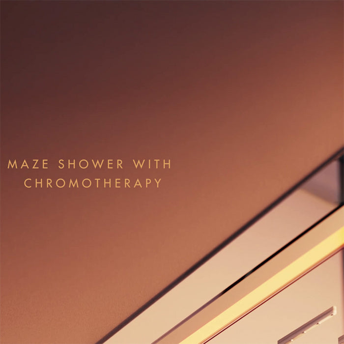Warm amber chromotherapy lighting surrounding the maze overhead shower in the Jaquar Oasis Steam Cabin.