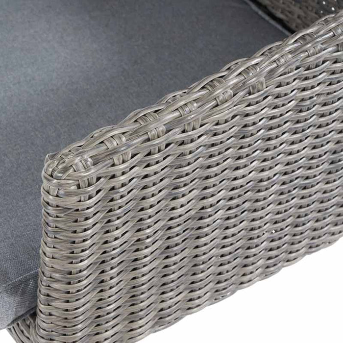 Larissa rattan dining chair armrest, close-up view.