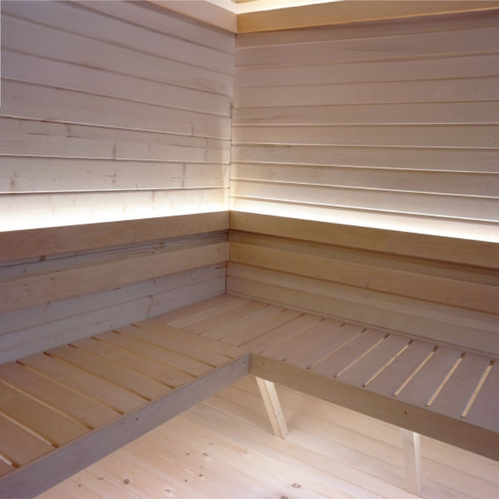 Close up view of illuminated wooden benches of the Luna Outdoor Sauna.