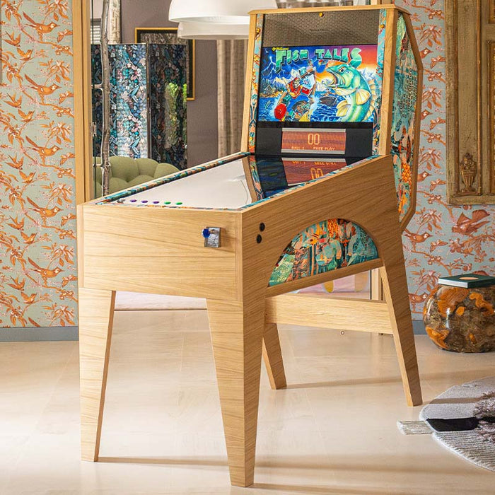 Maison Roshi Jiraiya Pinball Machine in living room with Fish Tales themed backglass, wooden body, and patterned side trim.