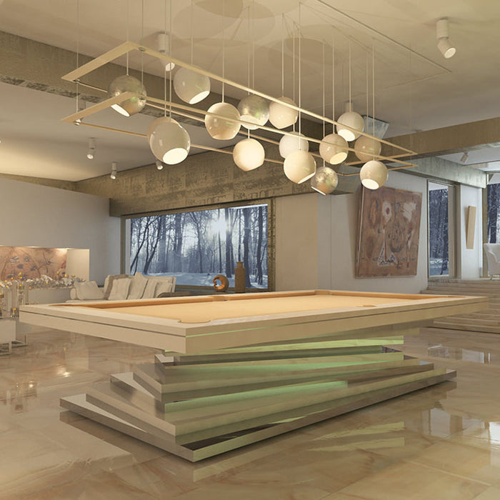 A modern MBM Biliardi Ziggurat pool table with a beige felt and frame, featuring a subtly illuminated stacked base in a luxurious interior.