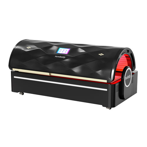 Sleek black Nuvibody PRO red light therapy bed shown closed from an angled side view with illuminated brand logo and premium finish.