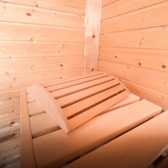 Close-up view of wooden benches and head rest inside the Traditional Sauna Cube.