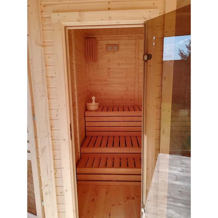 View through entry glass door to integrated sauna of the Traditional Sauna Cube 3 x 4m.