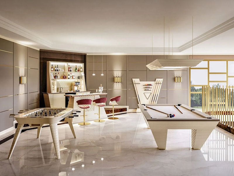 A white lacquered Vismara Newde Pool Table, complemented by premium finishes, blending seamlessly into a sophisticated entertainment area with bar seating.