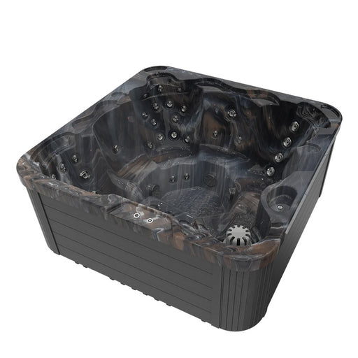 Wellis Sevilla Midnight Canyon Hot Tub viewed from the top side, revealing dark marble-effect shell with multiple jet points.