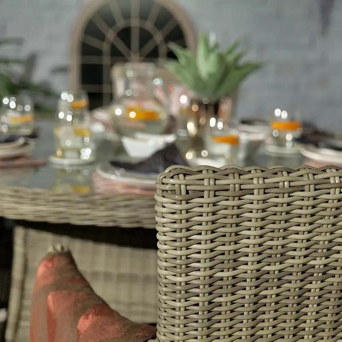 A detailed close-up shot of the rattan weave on a chair from the Wentworth 6 Seater Round Carver Dining Set, highlighting its craftsmanship and design.