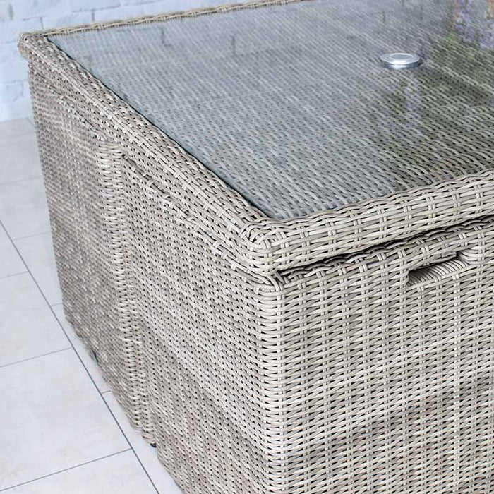 Side view of the Wentworth 8 Seater Cube Dining Set table, emphasizing its durable glass surface and woven rattan design.