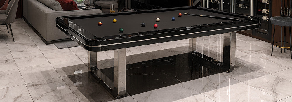 luxury black pool table with chrome legs in elegant living room with wine wall and marble flooring.
