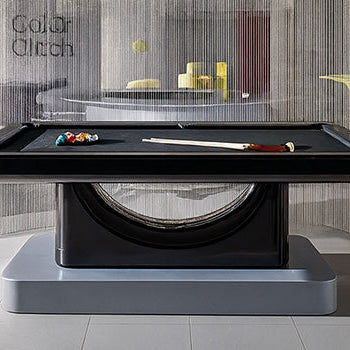 luxury black pool table in a modern minimalist room with metallic curtain and grey textured walls.