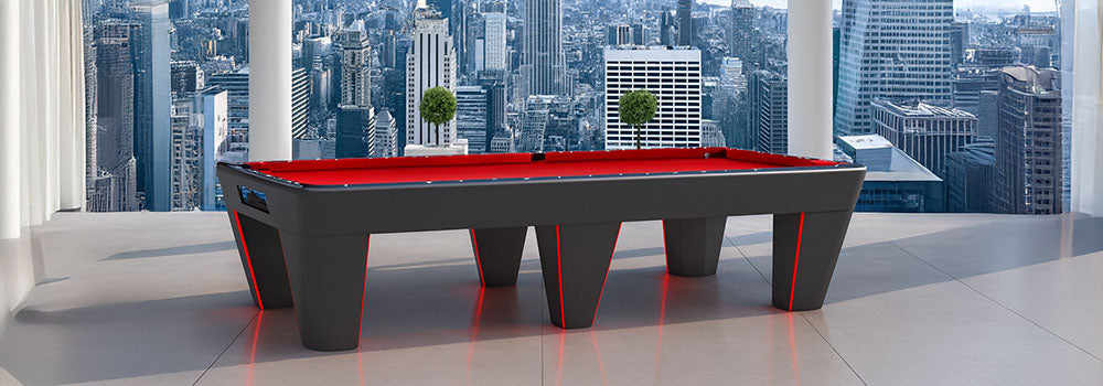 futuristic black pool table with red LED lights in a high-rise room overlooking the New York City skyline.