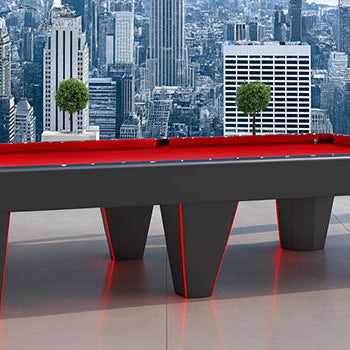 futuristic black pool table with red LED lights in a high-rise room overlooking the New York City skyline.