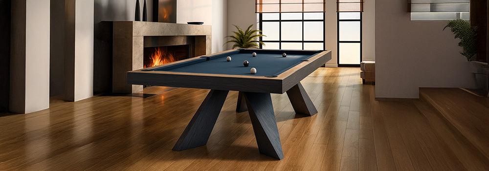 modern snooker table with blue felt in a warm, minimalist living room with fireplace and large windows.