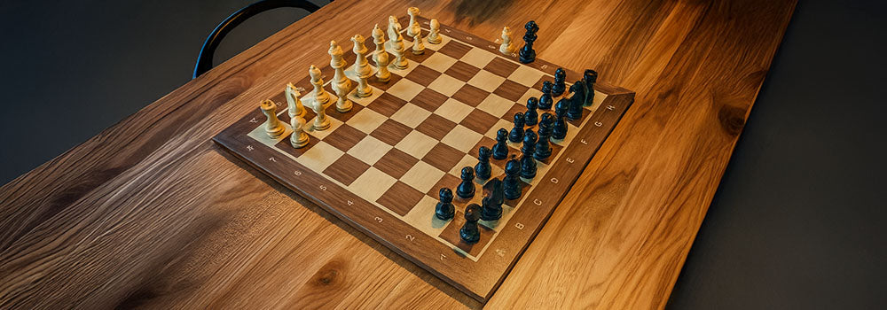 Classic wooden chess set on engraved board over natural grain dining table in ambient modern setting.