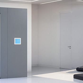 Cryotherapy chamber in a luxury fitness studio with panoramic city views and high-tech equipment.