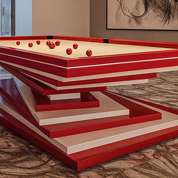 modern red and white designer pool table in a luxury marble-floored games room with pendant lighting and abstract wall art.