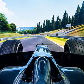 Immersive Formula racing simulator screen view showing an open-wheel race car driving at speed around a realistic motorsport circuit.