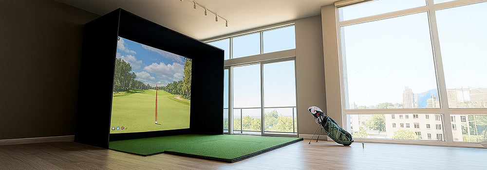 Bright apartment golf simulator with city view and wood floors.
