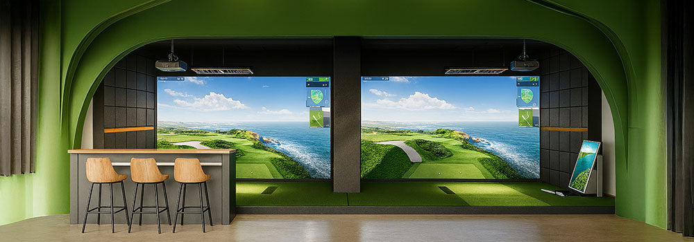 Dual golf simulator bays in a green-arched entertainment room with ocean view courses on screen.
