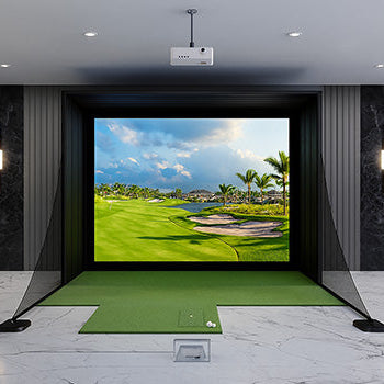 Modern indoor golf simulator with tropical fairway projection and marble flooring.
