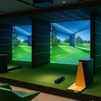 Stylish indoor golf simulator range with multiple projection bays, modern green chairs, and recessed lighting.