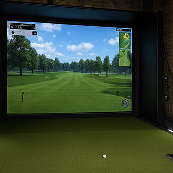 Rustic indoor golf simulator with wood flooring, barrel decor, and immersive course projection screen.