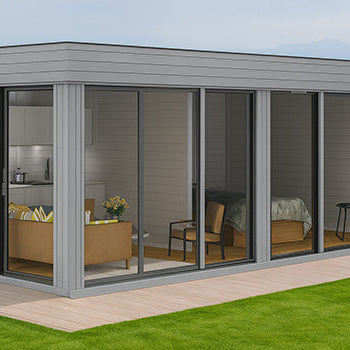 Modern grey garden room with floor-to-ceiling windows revealing lounge and bedroom areas.