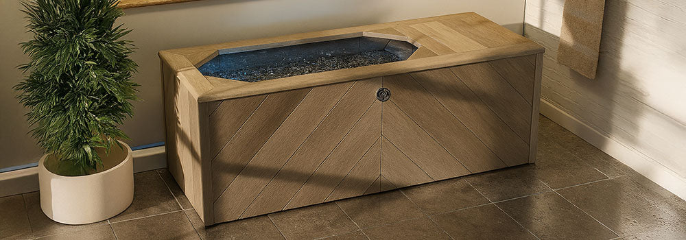 Luxury chevron wood ice bath in modern indoor spa room with soft ambient lighting.