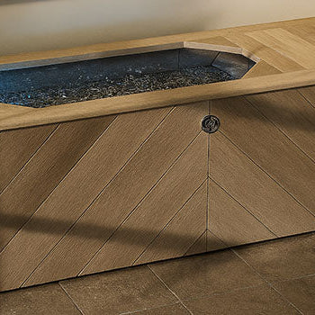 Luxury chevron wood ice bath in modern indoor spa room with soft ambient lighting.