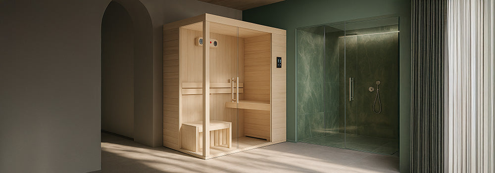 Minimalist indoor sauna with light wood and glass next to a green marble shower in a modern spa room.