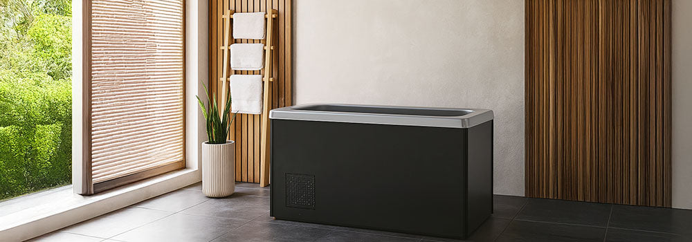 Ice bath in a serene spa room with wood paneling and natural light.