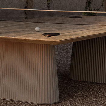 outdoor luxury ping pong table in Mediterranean courtyard with climbing ivy and soft sunset lighting.