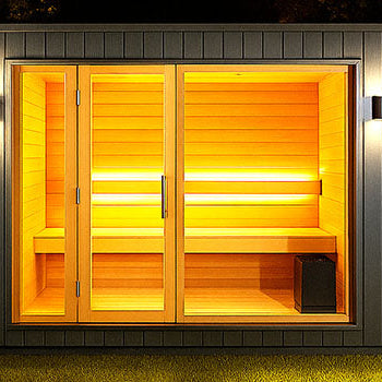 Modern outdoor sauna with illuminated wooden interior set in a dark garden at night with soft ambient lighting.