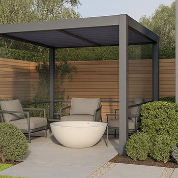 Modern pergola in a private garden corner with lounge seating and a white outdoor bathtub.