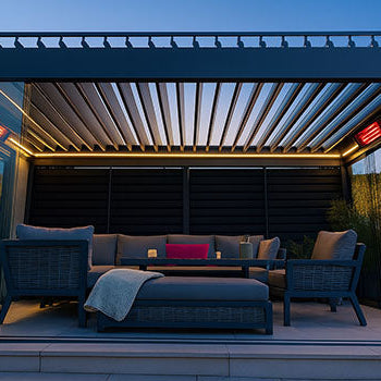 Luxury pergola with LED lighting, infrared heaters, and modern lounge seating at dusk.