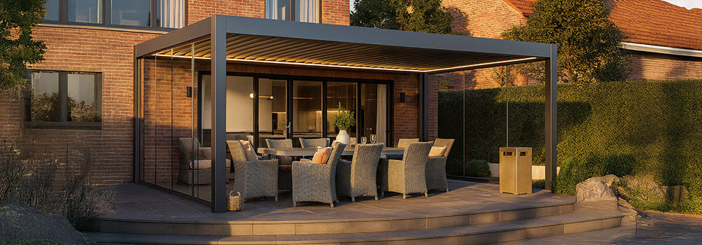 Sleek pergola with outdoor dining table beside brick house and manicured lawn.