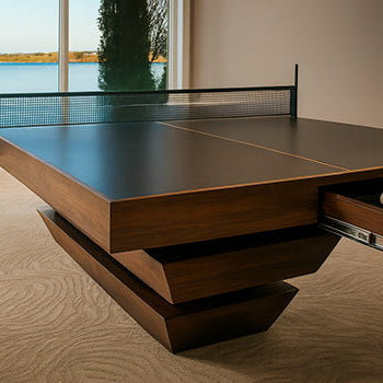 Luxury walnut table tennis table with hidden drawer in a lakeview room with beige carpet and full-height windows.