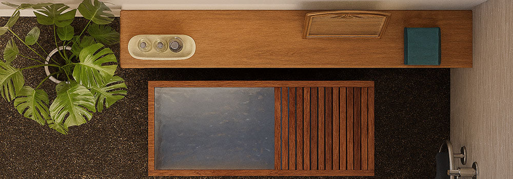 Top-down view of a wooden ice bath in a modern spa bathroom with accessories and indoor plant.