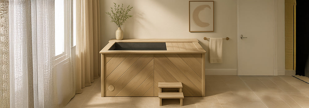 Modern wooden ice bath tub in a minimalist spa room with beige walls and soft natural lighting.