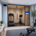 Altitude Centre MetraFit 3000 Active glass-enclosed training pod with light wood interior, housing a treadmill and exercise bike, in a bright home gym with blue-grey walls and natural light.
