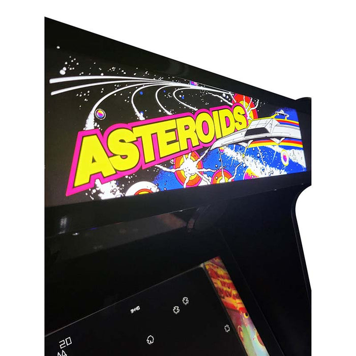 Close-up of the marquee display on an Asteroids style arcade machine.