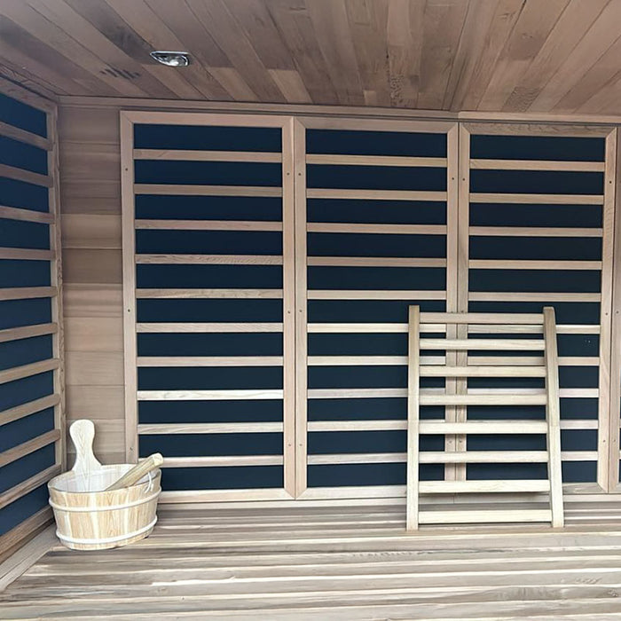 Spacious Artize Bio Sauna interior showcasing ergonomic wooden benches and powerful infrared heaters for deep heat therapy.