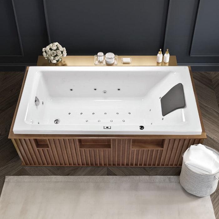 Overhead view of an Artize Superior Whirlpool bathtub in a dark-floored bathroom.