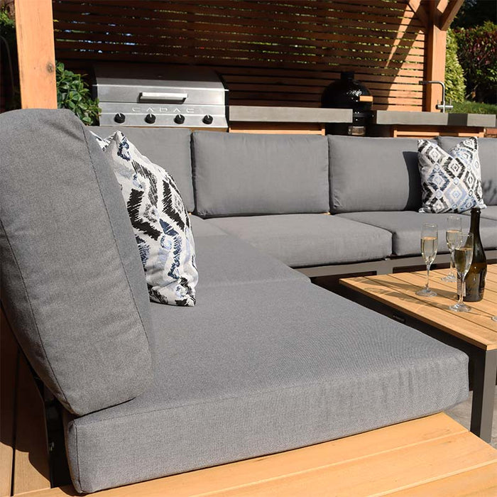 Outdoor garden setup of the Aspen 6 Seater Corner Lounge Set from Teak Wood, focusing on the adjustable backrest and durable grey cushions, blending style and function.